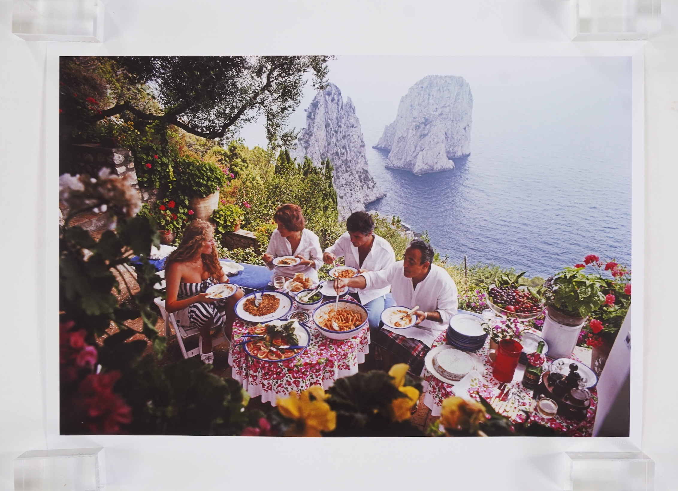 Slim Aarons, American 1916-2006, 'Dining al fresco on Capri, August 1980'